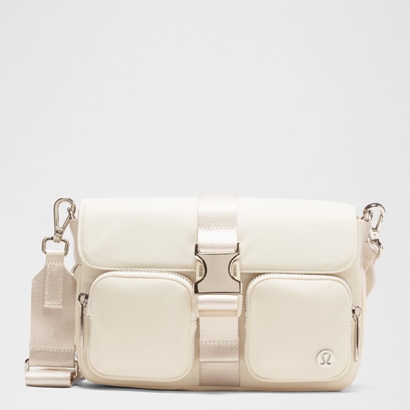 white lululemon crossbody bag Everywhere Belt 1L This lululemon Crossbody Camera Bag offers a sleek and contemporary way to carry your essentials while repping the Washington Capitals This cross Curved Crossbody Bag 3L |